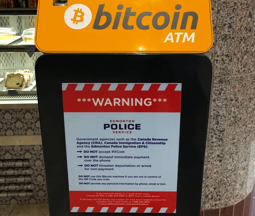 Bitcoin atm and warning placard from Edmonton, Canada