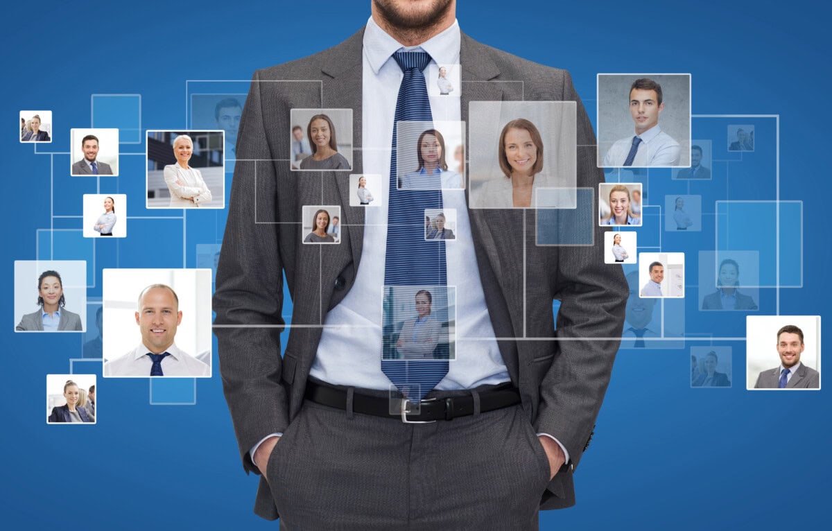 Close up of businessman over icons with contacts
