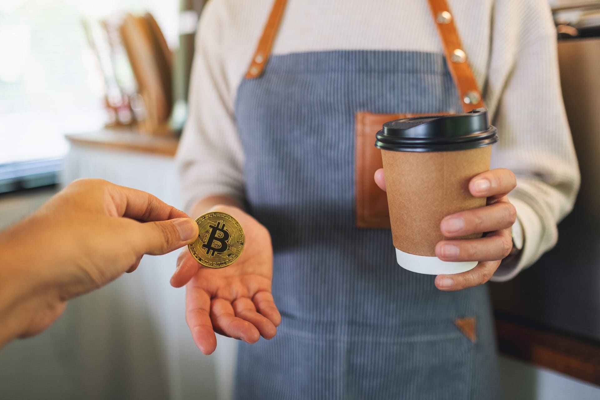 Closeup image of people buying coffee and paying with bitcoin for Crypto currency and digital finance concept